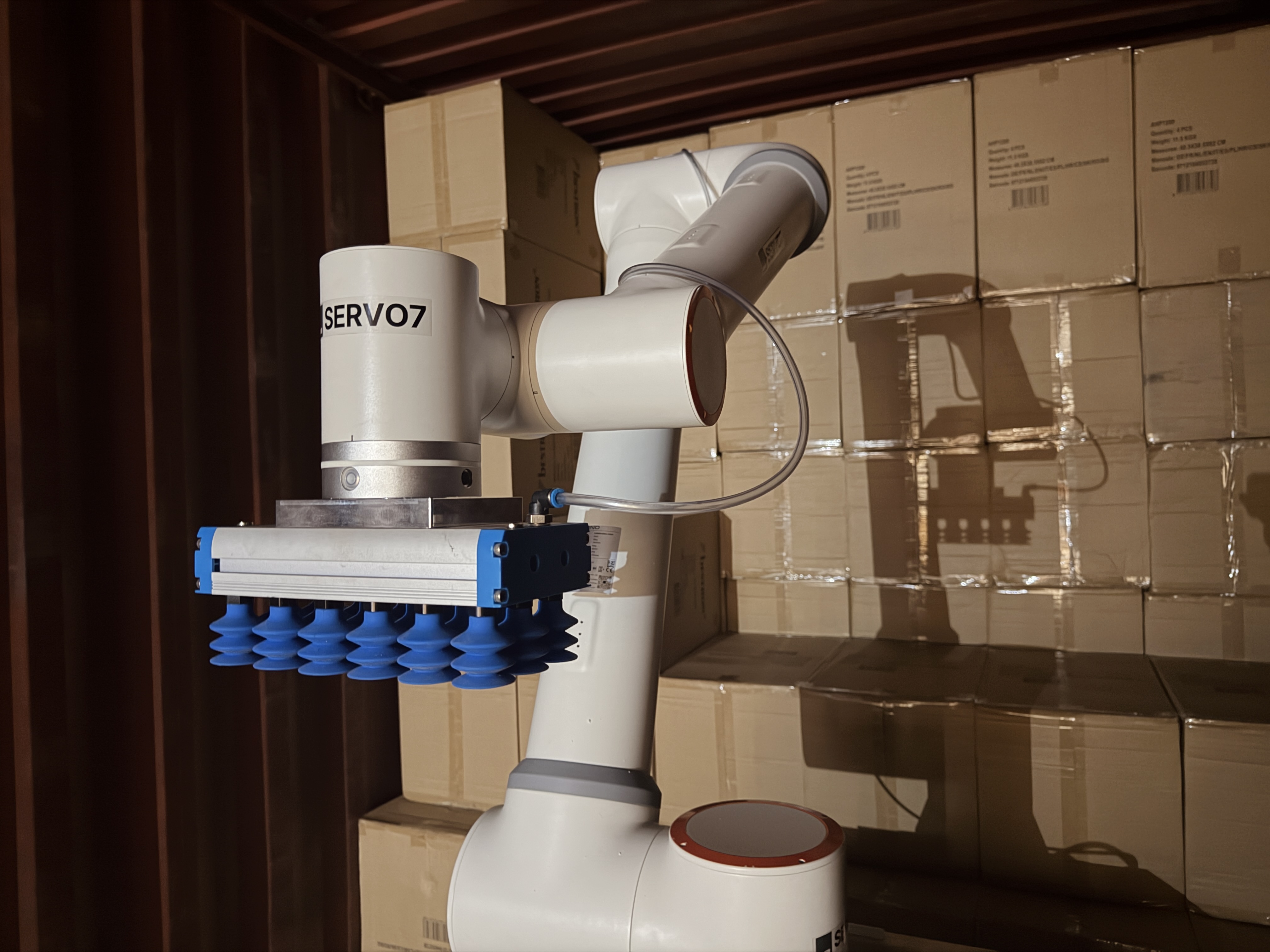 Servo7 robot at a shipping container